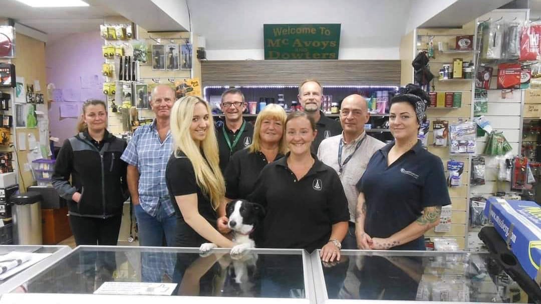 mcavoy employees and a display cabinet
