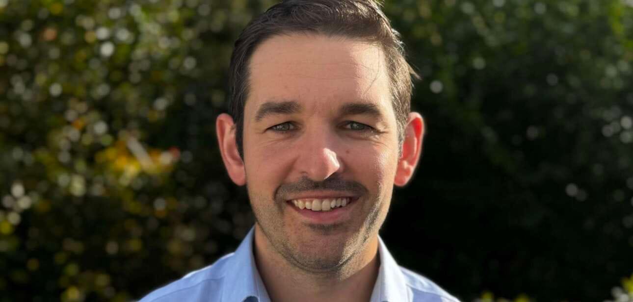 jack mullen smiling for a photo