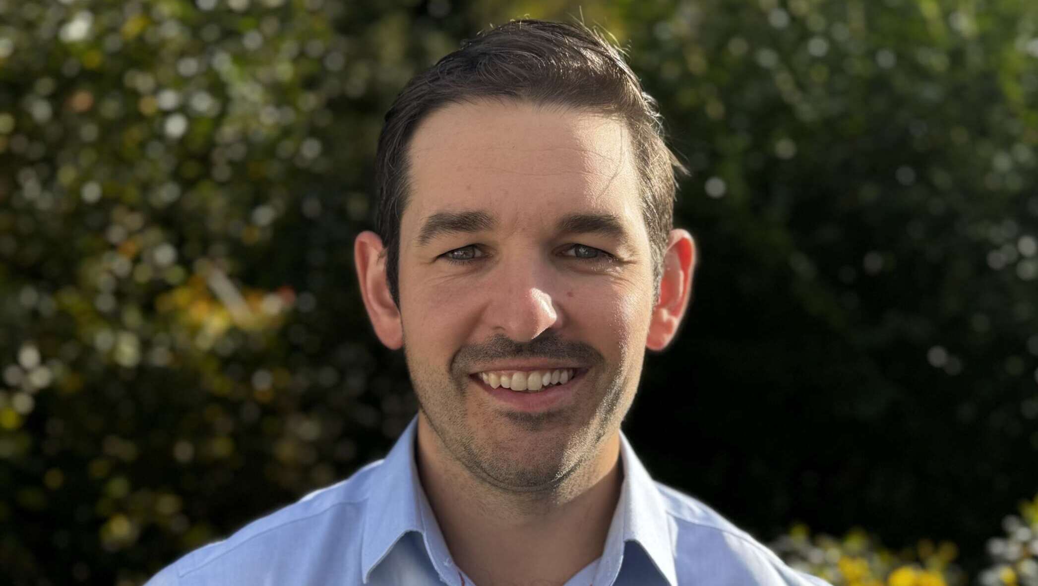 jack mullen smiling for a photo